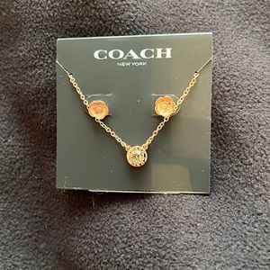 Coach earrings and necklace it